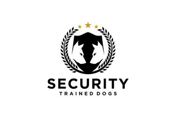 Guard dog training logo, with laurel wreath ornament and silhouette of two dog heads.