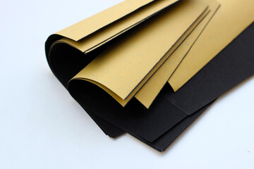 Black sandpaper on a white background.