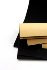 Black sandpaper on a white background.