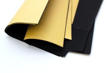 Black sandpaper on a white background.