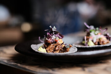 Mexican tacos with beef, vegetables and salsa. Tacos with dark  background in Peruvian restaurant Hong Kong