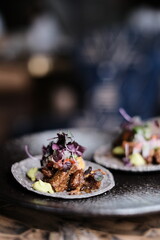 Mexican tacos with beef, vegetables and salsa. Tacos with dark  background in Peruvian restaurant Hong Kong