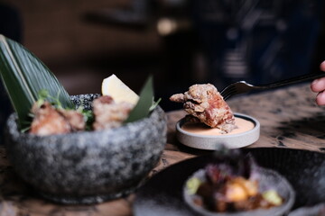 Crispy fried chicken with sauce, in a restaurant in Hong Kong fine dining