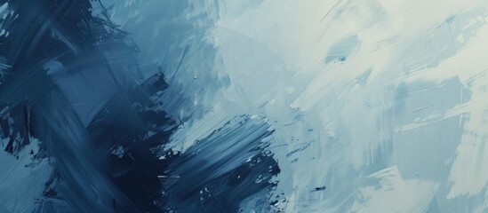 A painting showcasing abstract blue and white paint textures on a wall. The colors blend in a...