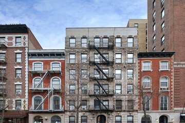 New York City old fashioned apartment buildings with external fire ladders - 749754406