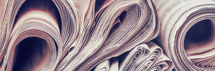 Newspapers, world news, concept of information, panoramic close-up photo.