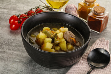 Soup with meatball and potato