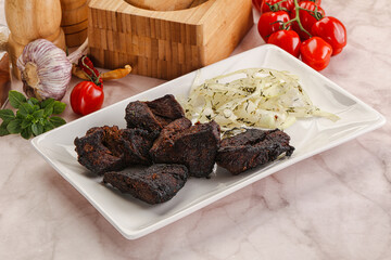 Grilled beef barbecue served onion