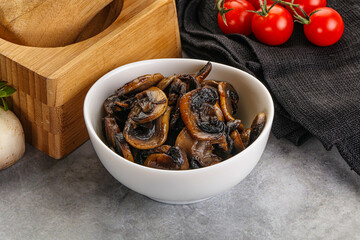 Roasted champignon mushrooms in the bowl