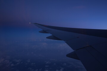 Sunrise and Cloudy Sky from Airplane Window - 飛行機からの景色	朝日