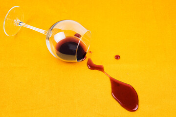a spilled glass of wine on the tablecloth. Cleaning clothes and furniture from stains.