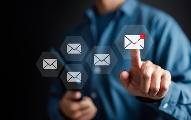 Businessman sending email by laptop computer to customer, business contact and communication, email icon, email marketing concept, send e-mail or newsletter, online working internet network.