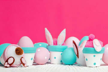 Easter decorations, flowerpots and handmade Easter eggs in pastel colors