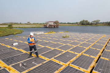 Engineer Analyzing Data on Floating Solar Panels