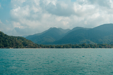 Seascape with Majestic Mountains, Tranquil Island, and Clear Blue Sky