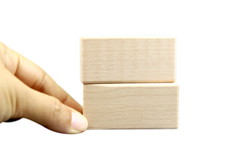 Wooden blocks, wooden toys, space for letters with hand isolated on white background.