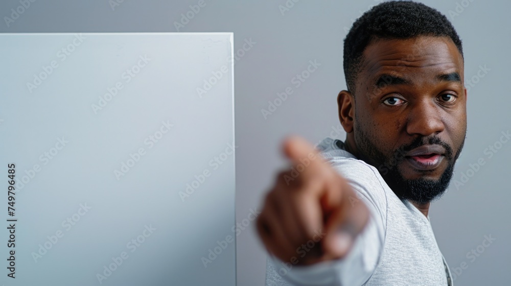 Poster a man pointing directly at the camera. great for business or communication concepts