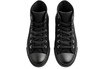 A Pair of Black Sneakers. The shoes are positioned side by side, showcasing their design and style. The contrast between the black footwear and the white surface creates a striking visual impact.