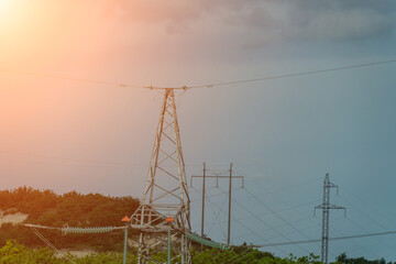High voltage towers with sky background. Power line support with wires for electricity...