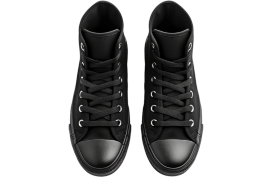 A Pair of Black Sneakers. The shoes are positioned side by side, showcasing their design and style. The contrast between the black footwear and the white surface creates a striking visual impact.