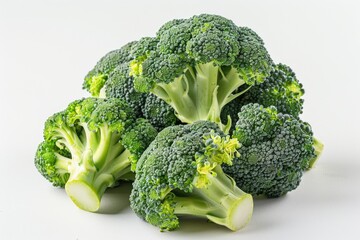 A pile of fresh broccoli on a clean white surface. Perfect for healthy eating concept