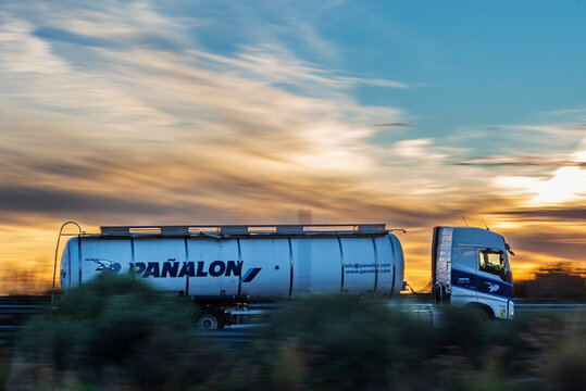 Algeciras, Cadiz, 2,27,2024; Tank truck from the Pañalon company traveling on a highway, side view, photographic sweep.