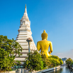 Stupa and statue of Buddha in Paknam Phasi Charoen in the streets of Bangkok - Thailand - 749815073