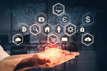 Close up of businessman hands holding creative hexagonal hologram on blurry office interior...