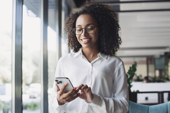 Business woman using smartphone in modern office, Student girl texting on mobile phone indoors, Communication, connection, mobile apps, technology, business lifestyle concept