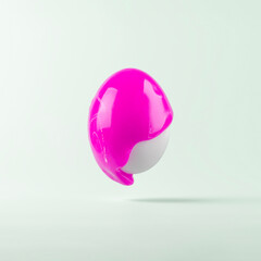 Easter egg painted with pink paint on blue pastel background. Creative Easter concept.