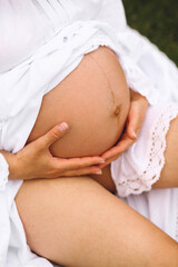 Close up photo of a pregnant womans belly. Love concept