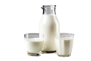 Bottle of Milk and Two Glasses of Milk. A bottle of milk stands beside two glasses filled with milk. The glasses are half full, and the setting appears to be a kitchen or dining area.