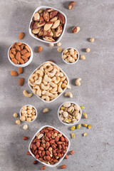 Healthy mix nuts and dried fruits on wooden background. Almonds, hazelnuts, cashews, peanuts, pistachios, Brazilian nuts
