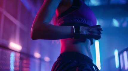 Focused athlete in a neon-lit gym checks her smartwatch, syncing her training data in real-time, embodying the fusion of technology and fitness. - obrazy, fototapety, plakaty