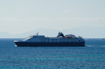 Modern pax passenger car cargo ferry cruiseship cruise ship liner at sea with blue ocean