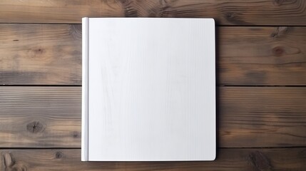 White Book from Above, Resting on an Old Wooden Plank Background.