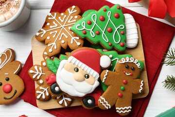 Tasty homemade Christmas cookies on white wooden table, top view