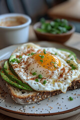 Avocado Egg Sandwiches for healthy breakfast. Whole grain toasts with avocado, fried eggs and organic microgreens on white table.