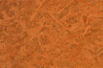 Construction oriented chipboard covered with brown varnish, original woody background plate.