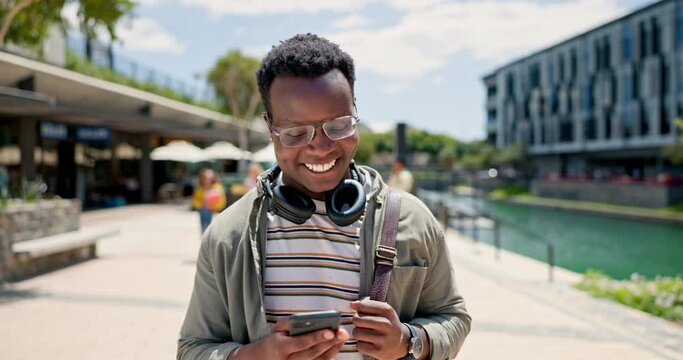 Phone, laugh and happy black man in a city walking, reading or checking silly social media meme. Travel, smartphone and African male person outdoor with funny, text or gif communication on commute