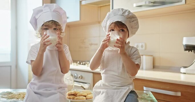 Little Chefs' Milk Break: Enjoying a Refreshing Drink After Baking
