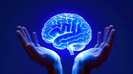 Human hands holding a blue glowing brain.
