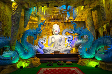 White Buddhists in temple Wat Trai Samakkhi, Naga statue, Sisaket Province, Thailand, Asia.