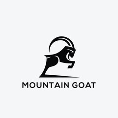 White Goat On The Mountain Logo Design. Goat standing proudly on the top of the mountain Logo Design