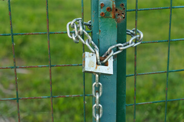 The Green Gate Secured With a Chain