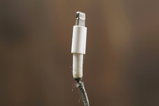 Faulty phone charging wire, wire insulation destroyed.
