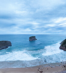 Coastal landscape on the beach of Andr&iacute;n or Ballota and the Castro Ballota island in the surroundings of the town of Andr&iacute;n. Cantabrian Sea. Council of LLanes. Asturias. Spain. Europe