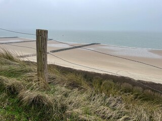 fence on the dunes at the north sea in Zeeland Netherlands
