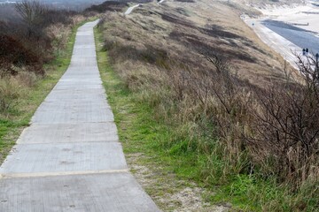 wide path high above the dunes on the north sea Zeeland Netherlands