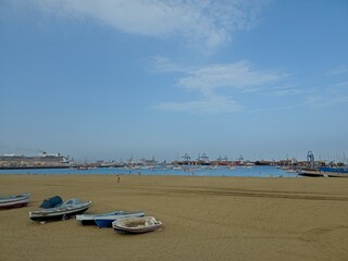 Moored boats at the Alcaravaneras beach during a summer day in Las Palmas de Gran Canaria, Spain